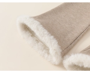 Detailed close-up of warm khaki knit cuffs with thick white faux fur trim for winter
