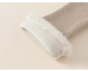 Close-up of warm faux fur lining and ribbed knit texture on a girls winter vest