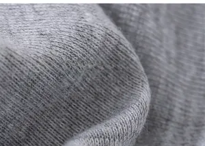 Close-up of soft grey knitted fabric detail showing high-quality elastic texture