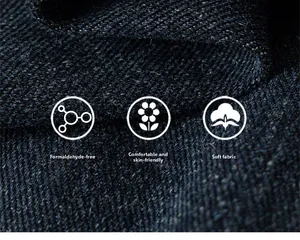 Macro detail of skin-friendly dark blue denim fabric with soft texture and twill weave