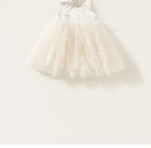 Detail of girls' cream mesh cake dress with traditional Chinese collar and frog buttons