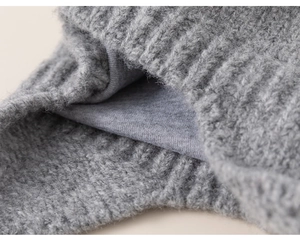 Detail view showing dual-layer knit texture and soft lining of a gray winter hat