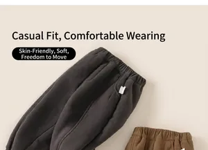 Detail of soft corduroy fabric texture and comfortable elastic waistband on kids trousers