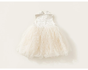 Detailed view of white girls' sleeveless princess dress with floral jacquard and tulle layers
