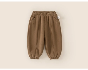 Detailed close-up of thickened thermal knit trousers with elastic waist for boys
