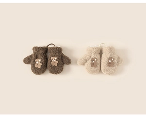 Detail of warm plush children mittens with 3D cartoon bears and anti-lost string