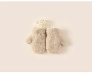 Detailed view of plush beige fleece toddler mittens with anti-lost neck string