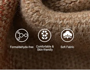 Macro detail of soft brown and beige chunky knit fabric with plush winter texture