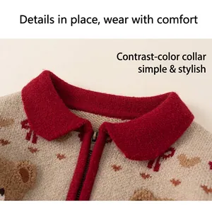 Close-up of contrast collar and zipper detail on knit cardigan with bear pattern