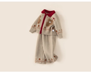 Detail of oatmeal knit cardigan and pants with bear embroidery and red collar trim