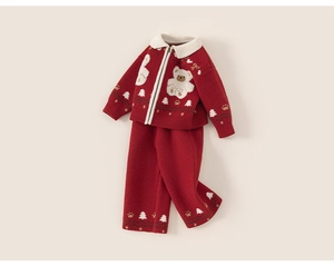 Detail of red knit kids set with zipper cardigan and white bear embroidery patch