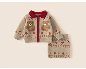 Close-up of girls knitted cardigan and skirt set featuring red accents and 3D teddy bears