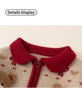 Detail of children's knit sweater featuring zipper collar and cute bear pattern jacquard