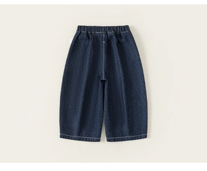 Close-up of deep blue denim texture and elastic waistband on classic kids' jeans