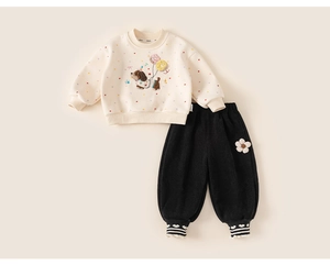 Detail of baby girl fleece sweatshirt with cute puppy embroidery and heart patterns