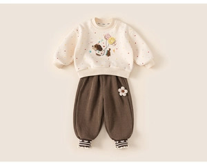 Detail of toddler puppy sweatshirt and brown corduroy pants with 3D floral accents