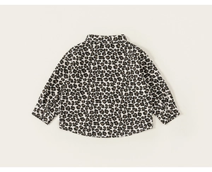 Detail of child shirt back view featuring full leopard print and curved hem design