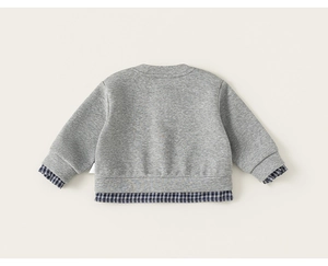 Back view of gray kids sweatshirt with dark blue checkered shirt hem detail