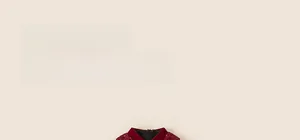 Detail of red festive children dress with sparkling sequins on collar and shoulders