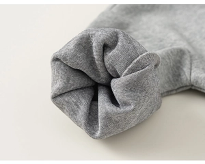 Detailed macro view of the grey ribbed cuffs showing premium knitted cotton texture
