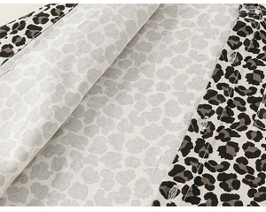 Detailed macro view of the buttonhole and durable twill fabric on leopard print shirt