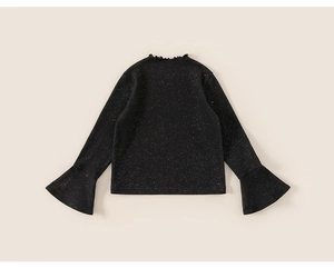 Detail of kids black star-patterned sweater with ruffled collar and flared sleeves