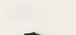 Close-up of classic lapel collar and premium PU leather texture on children's jacket