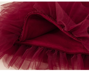 Detail of wine red multi-layer mesh skirt with thick warm velvet lining for girls
