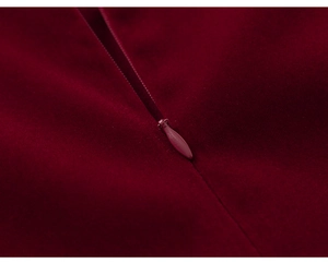 Detail of high-quality burgundy velvet fabric with a matching invisible back zipper