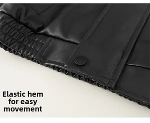 Detail of children's black faux leather jacket featuring elastic hem and snap button closure