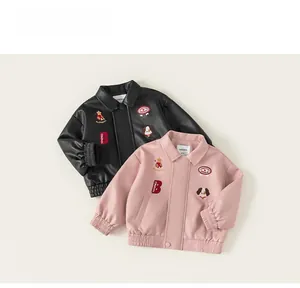 Detail showing two kids PU leather biker jackets in black and pink with embroidered badges