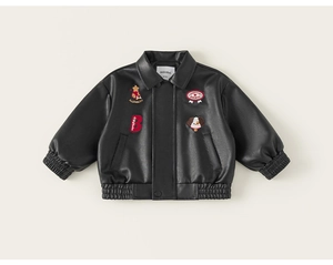 Detailed close-up of kids' black faux leather jacket with high-quality embroidery patches
