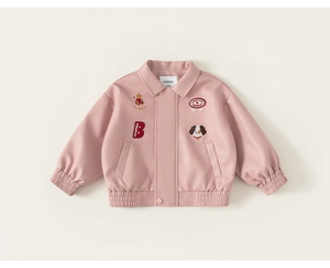 Detail of pink faux leather kids jacket with embroidered dog patches and lapel collar