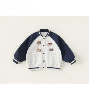 Detail of navy and gray baseball jacket with Lucky Bear embroidery and ribbed cuffs