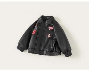 Detail of kids black faux leather jacket with cartoon dog patch and red letter B embroidery