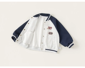 Detail of kids baseball jacket showing Lucky Bear embroidery and ribbed cuffs