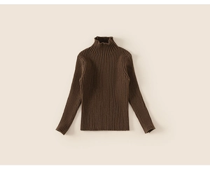 Close-up of dark brown ribbed knit turtleneck sweater for children with soft texture