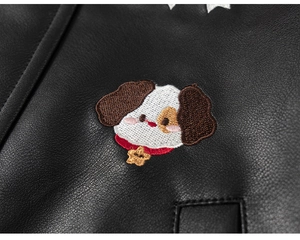 Detailed view of kids leather jacket featuring high-quality cartoon dog embroidery