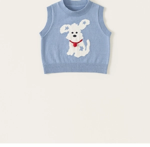 Detailed view of light blue knitted vest with cute puppy pattern and ribbed hems for girls