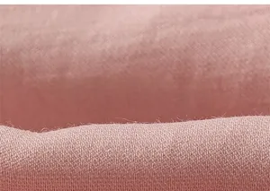 Macro view of soft pink knitted fabric texture on girls' casual leisure pants