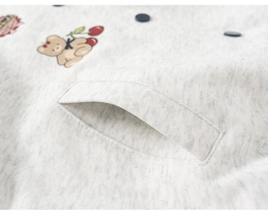 Detail of heather grey knit jacket with bear cherry embroidery and side pocket
