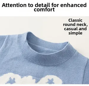 Close-up of the classic ribbed crew neck and soft knitted fabric with cloud patterns