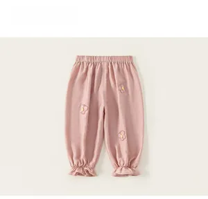Close-up of pink toddler joggers with butterfly embroidery and elastic ruffled cuffs