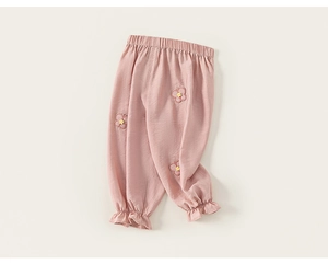 Detailed view of pink toddler pants featuring floral embroidery and ruffled elastic cuffs
