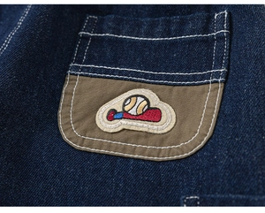 Close-up of baseball embroidery on a dark blue cargo pocket for toddler denim pants