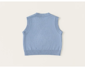 Detail of light blue knitted vest featuring ribbed crew neck and soft texture for toddlers