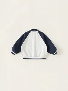 Kids color-block baseball jacket with grey bodice and navy raglan sleeves in a flat lay view