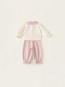 Toddler girl two-piece spring set with cream doll collar top and pink ruffled joggers