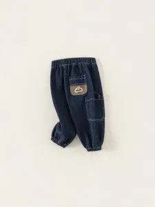 Boy's navy blue cargo denim joggers with elastic waist and large side pockets