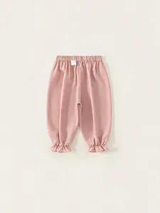 Pink girl's elastic waist joggers with ruffle cuffs and loose fit design for spring